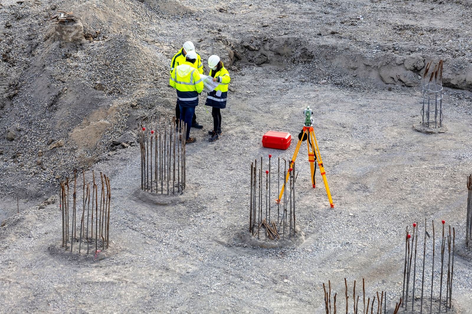 Survey crew coordinating on a commercial foundation site